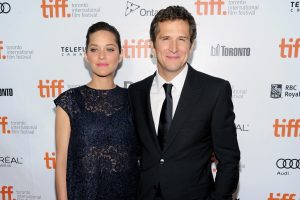 French actress Marion Cotillard and companion director Guillaume Canet arrive at the premiere of "Blood Ties" on day 5 of the 2013 Toronto International Film Festival at the Roy Thomson Hall on Monday, Sept. 9, 2013, in Toronto. (Photo by Evan Agostini/Invision/AP)